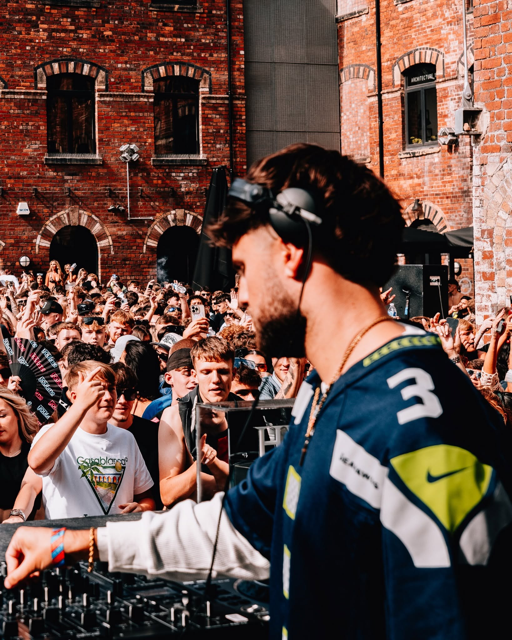 DJ performing to a daytime crowd in The Courtyard