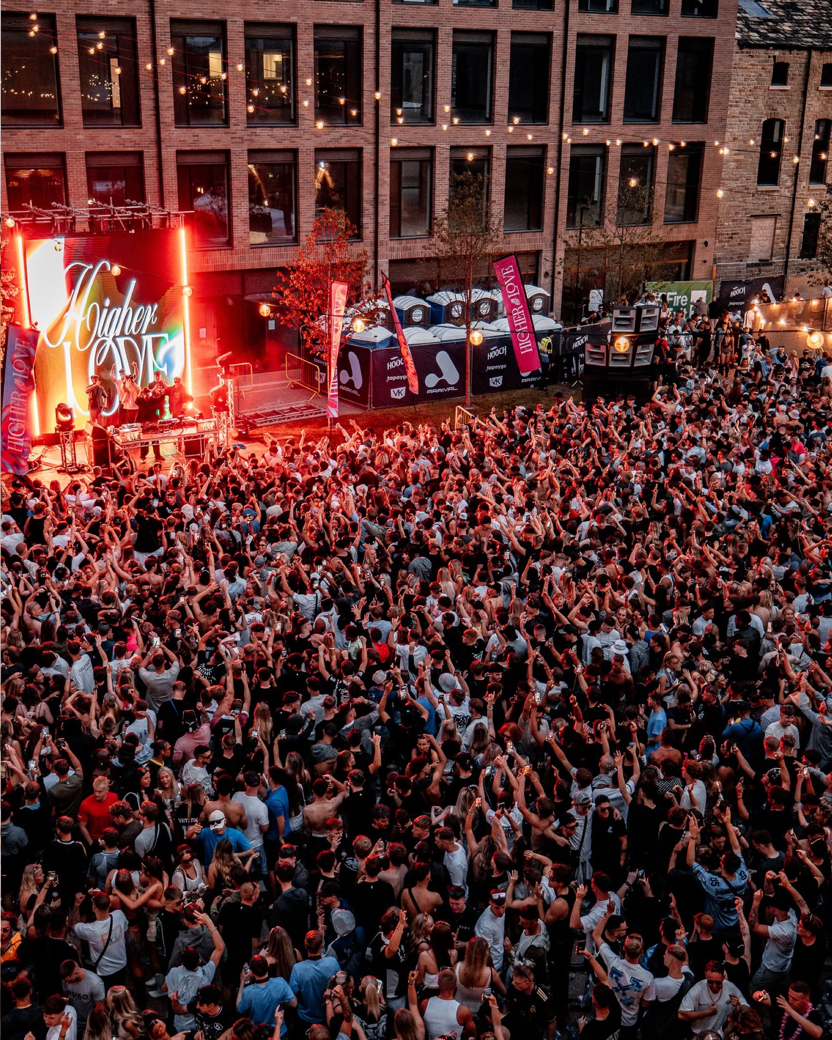 A large open-air music event filling The Courtyard