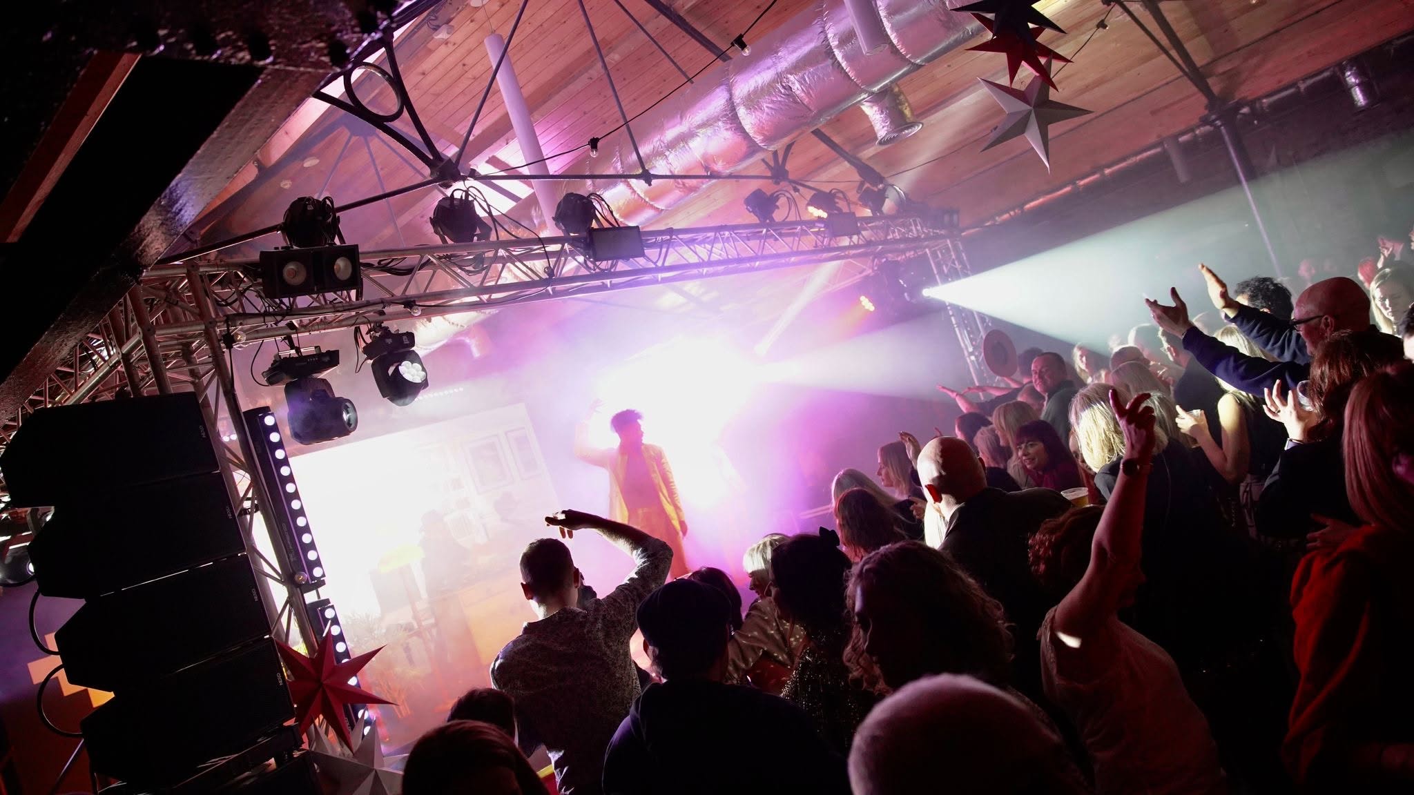 A live music event filling The Carding Shed